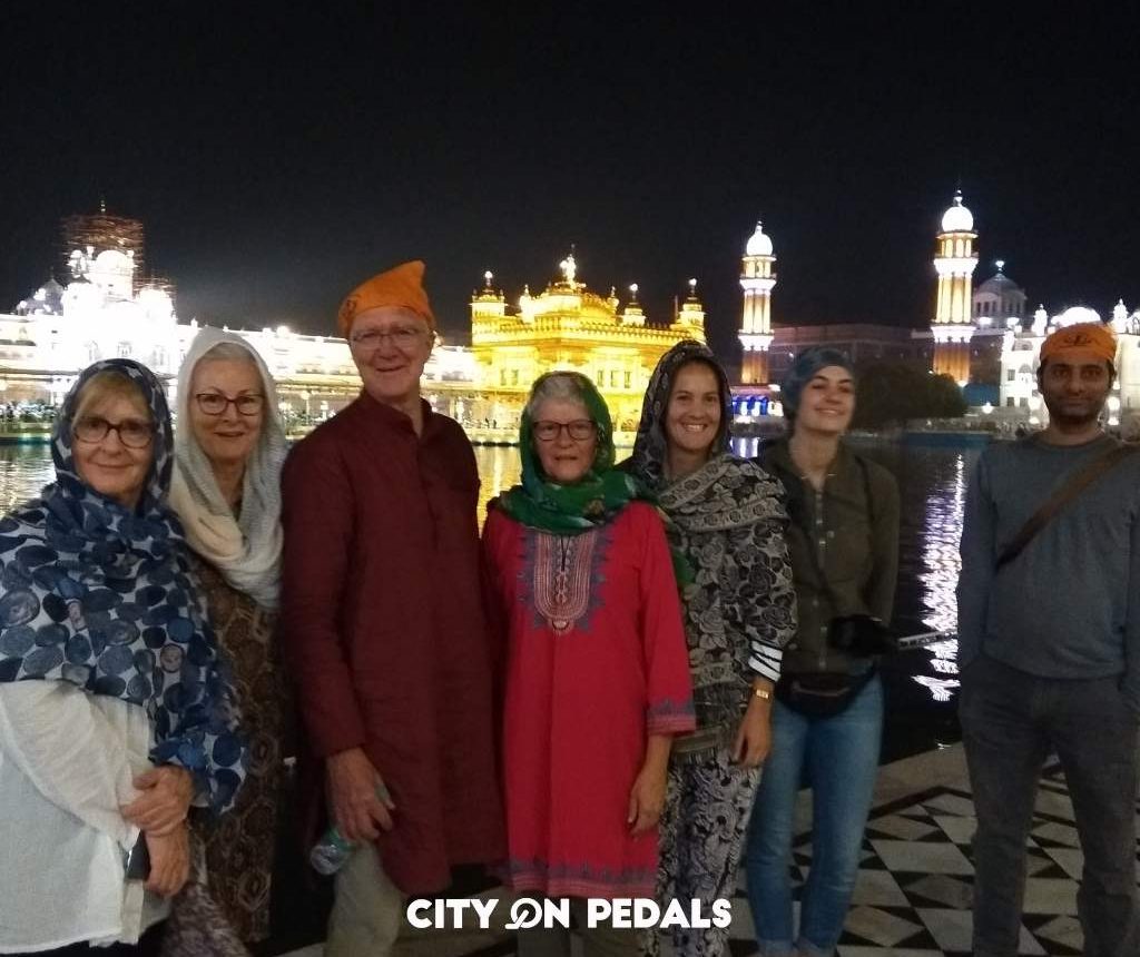 Mixed group of travelers at the Golden Temple