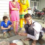 German traveler making rotis on Amritsar Village Tour