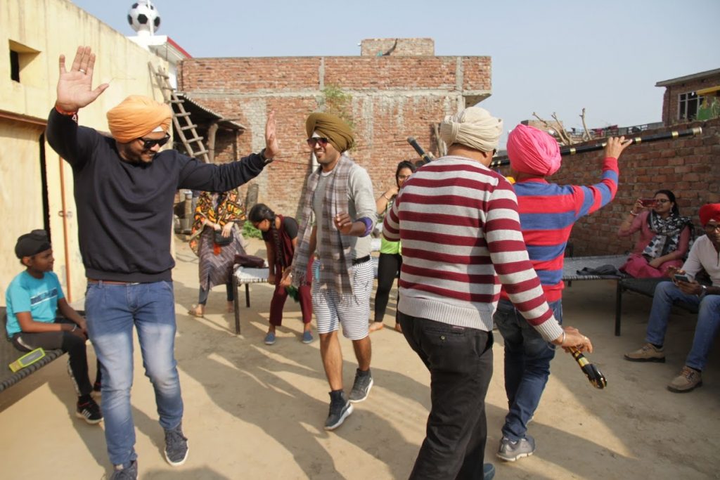 People enjoying Lohri by doing Bhagra